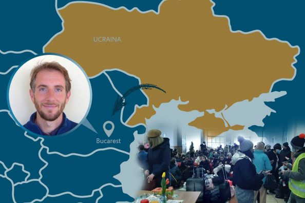 Piero Loredan gesuita e un gruppoo di volontari e profughi ucraini sopra una cartina della zona di guerra in Ucraina